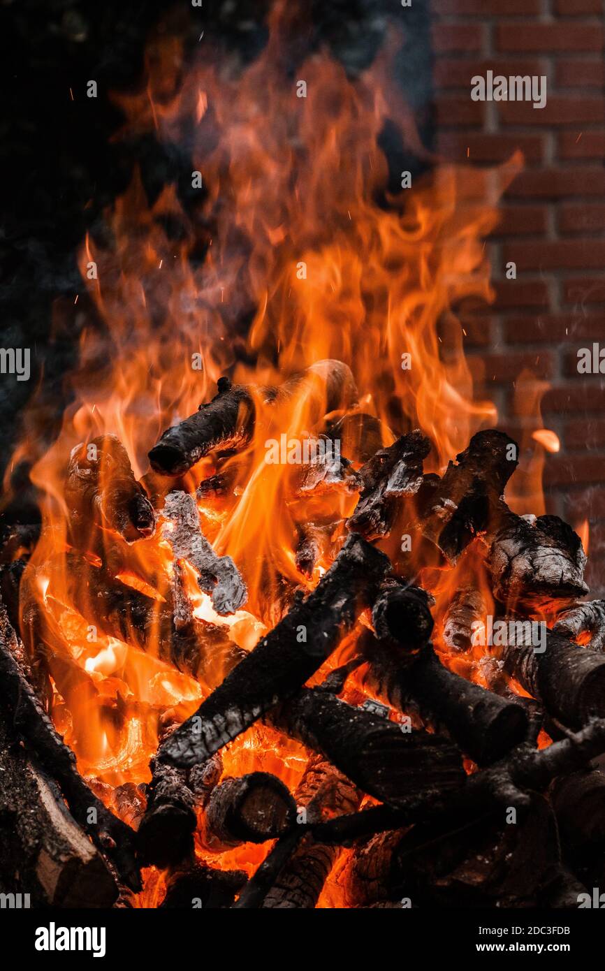 Fire burning tree branches, ember glowing Stock Photo Alamy