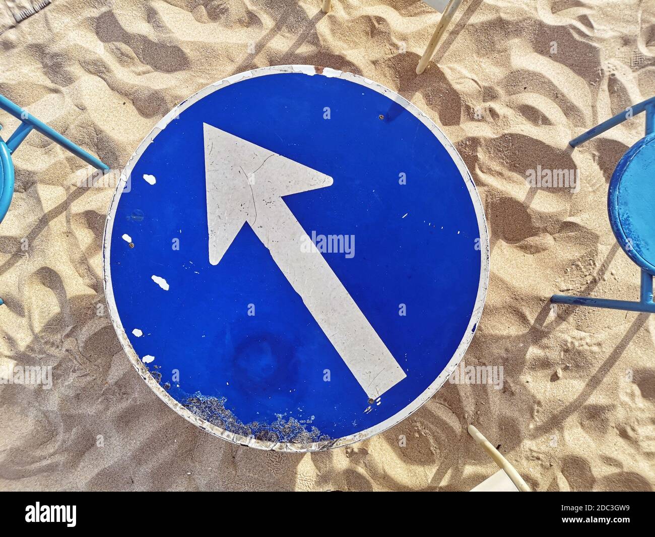 Streetsign Table and chairs at a beach bar in Lagos, Portugal Stock