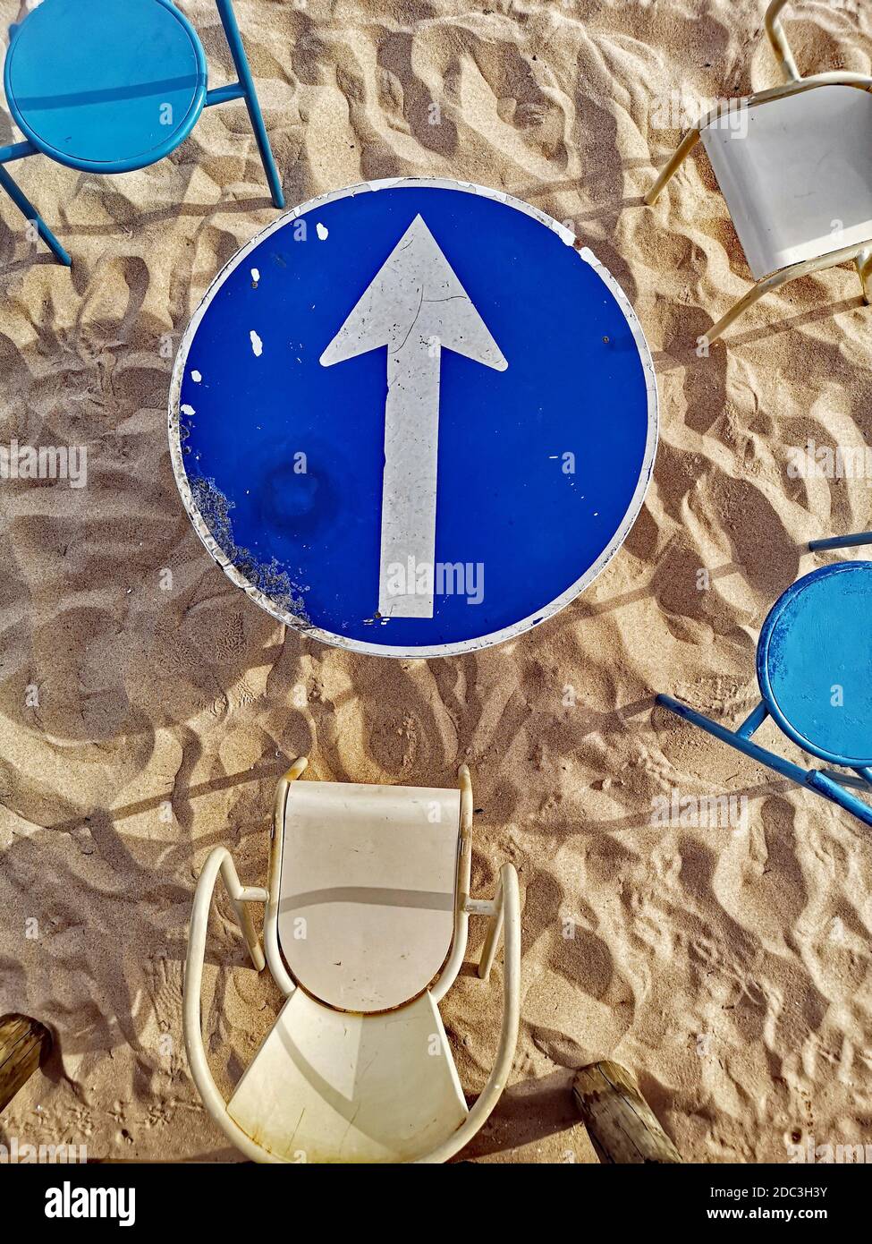 Streetsign Table and chairs at a beach bar in Lagos, Portugal Stock