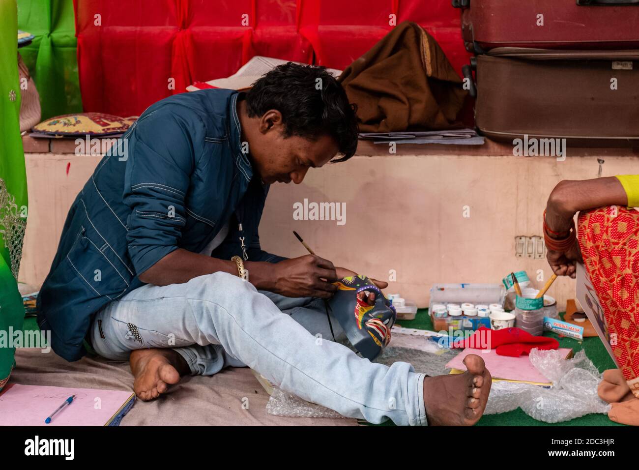 New Delhi, India, November 2019 : An artist making craft products in ...