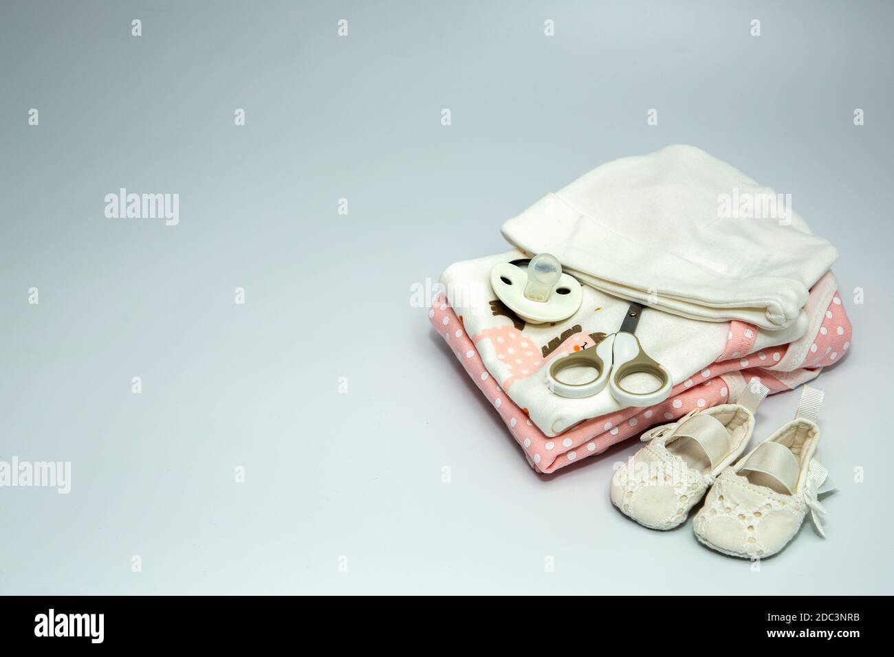A pile of baby clothes and accessories. Stock Photo