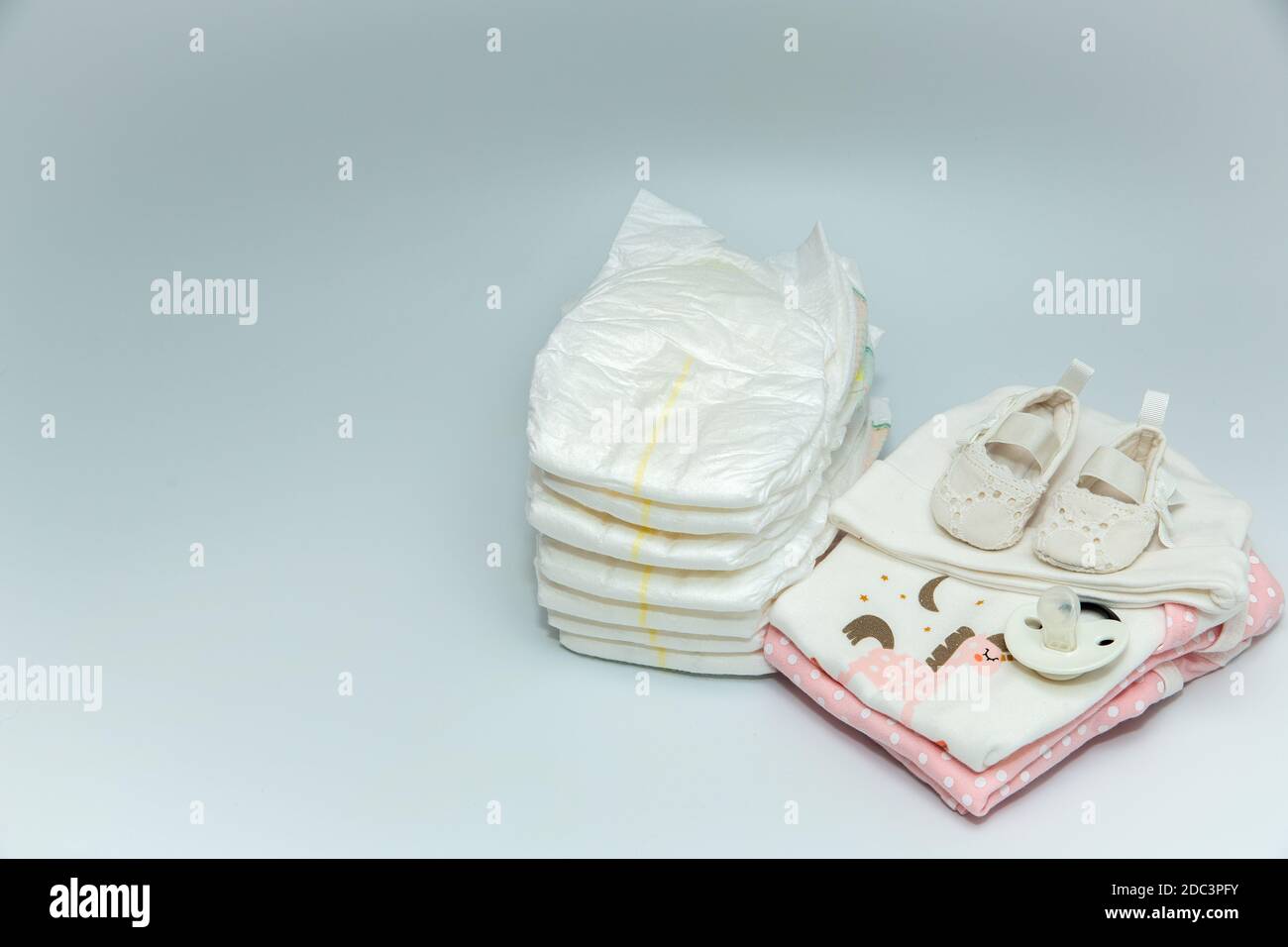 A pile of baby clothes and accessories. Stock Photo
