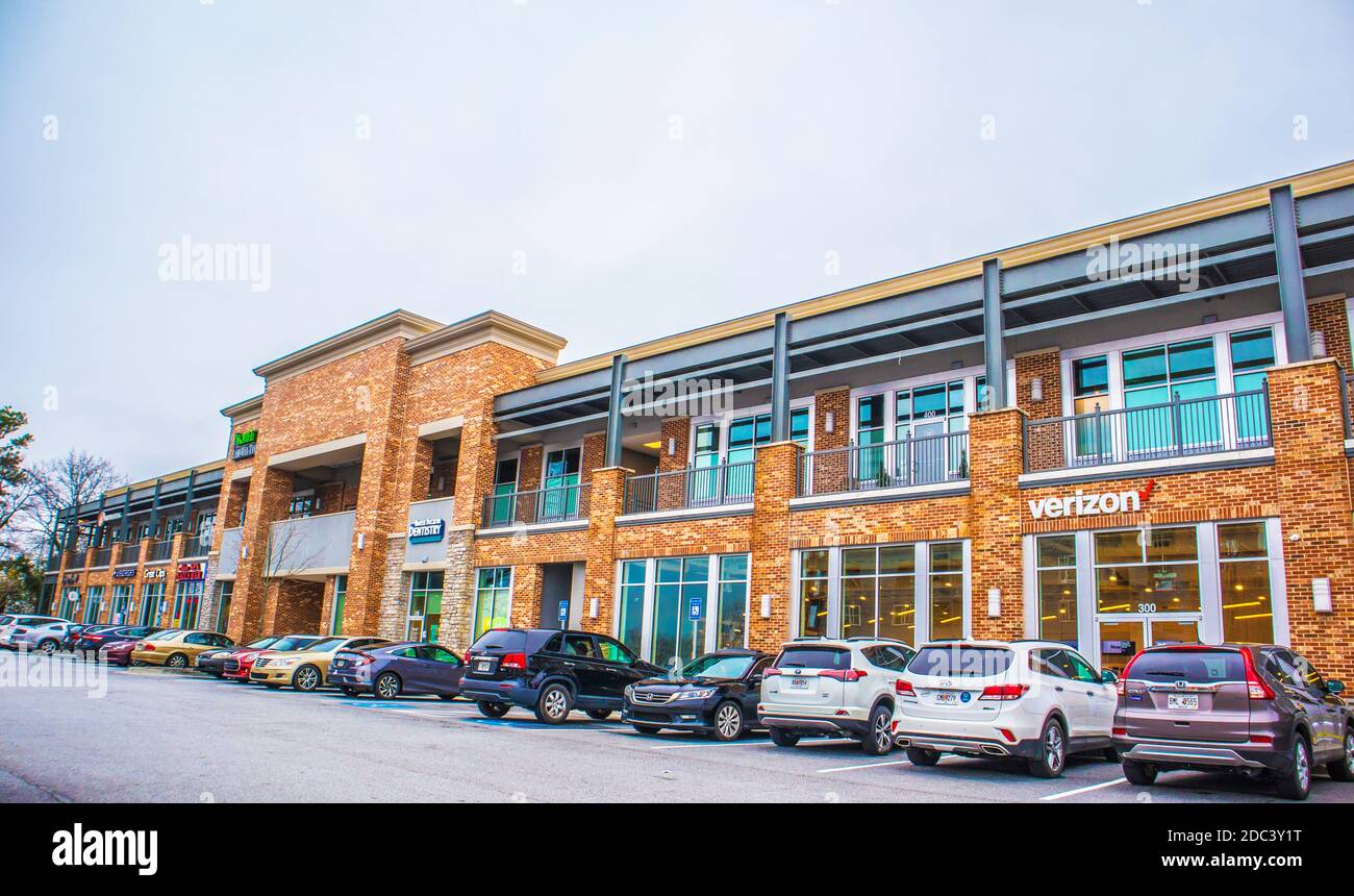 County, Ga / USA 02 19 20 A shopping plaza and cars parked