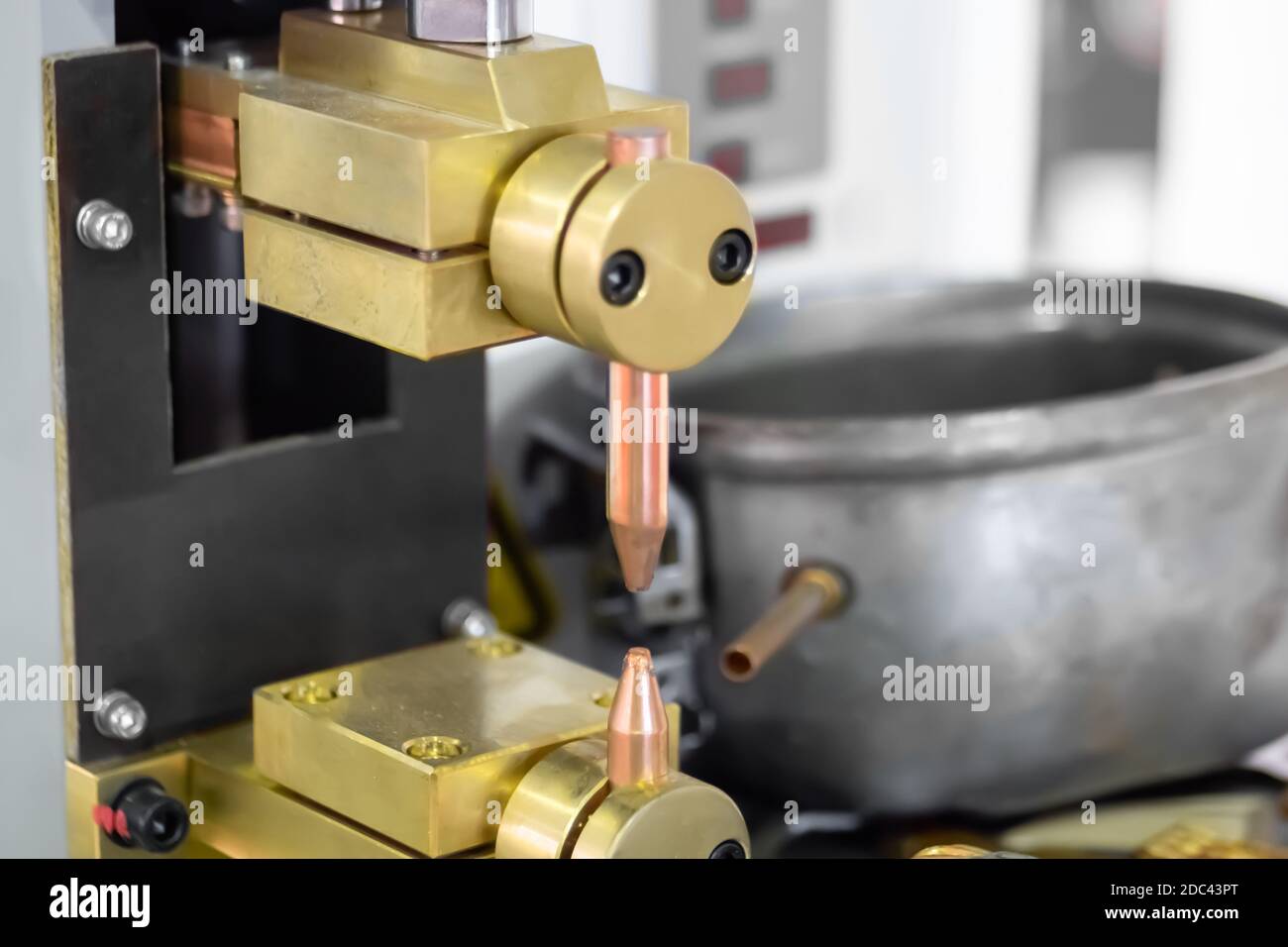 Copper electrodes of spot welding machine at factory, plant close up