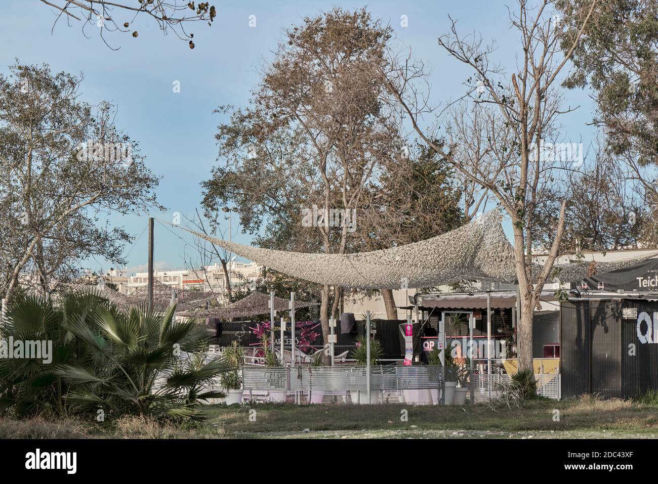 disco, bar, pub with a tent, plants, trees and flowers in the open air on the beach of the town of Borriana, Burriana, Castello, Castellon, Spain. Stock Photo