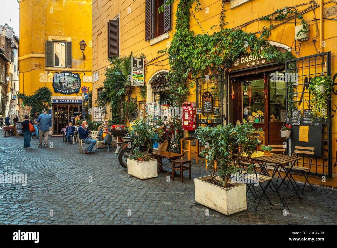 Beautiful old street in Trastevere, Rome, with typical outdoor restaurants. Rome, Lazio, Italy, Europe Stock Photo