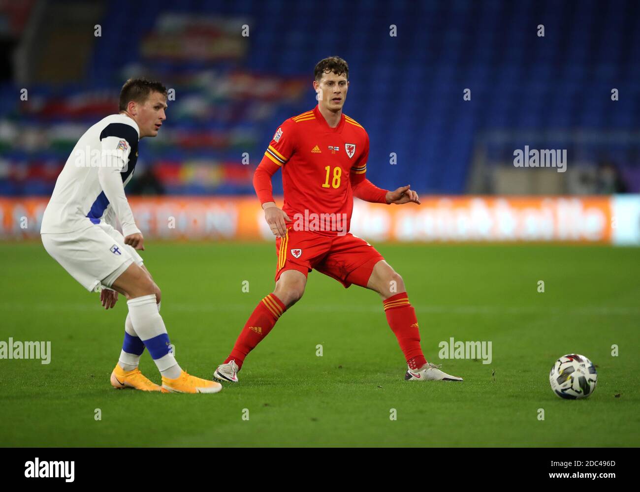Finland's Robin Lod (left) and Wales' James Lawrence battle for the ball during the UEFA Nations League match at Cardiff City Stadium. Stock Photo