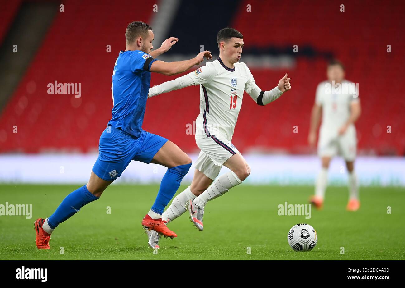 Iceland's Sverrir Ingason (left) and England's Phil Foden in action during the UEFA Nations League match at Wembley Stadium, London. Stock Photo