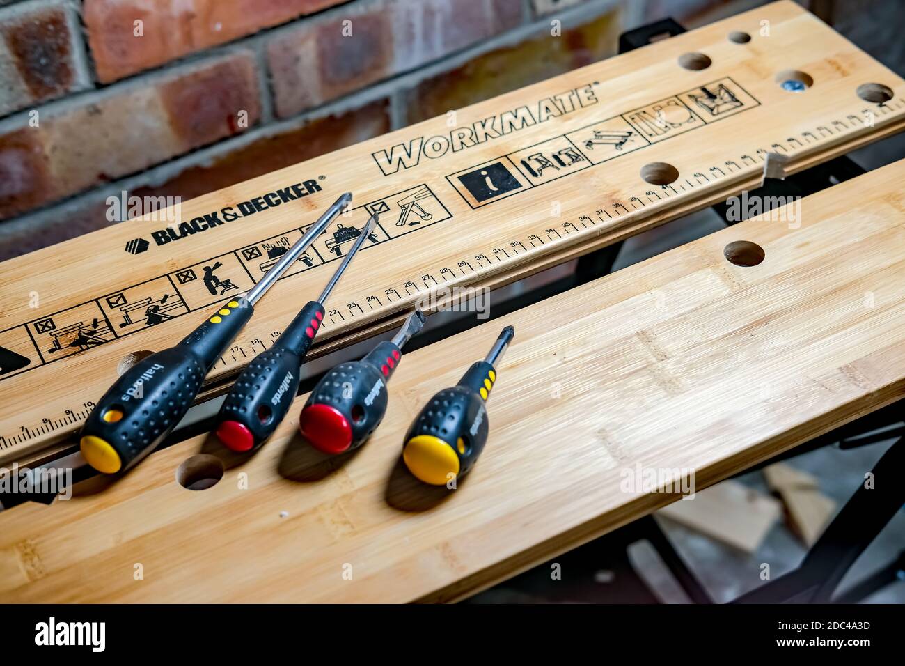 https://c8.alamy.com/comp/2DC4A3D/norwich-norfolk-uk-november-17-2020-an-illustrative-photo-of-a-black-and-decker-workmate-bench-with-a-selection-of-halfords-branded-screw-drivers-2DC4A3D.jpg