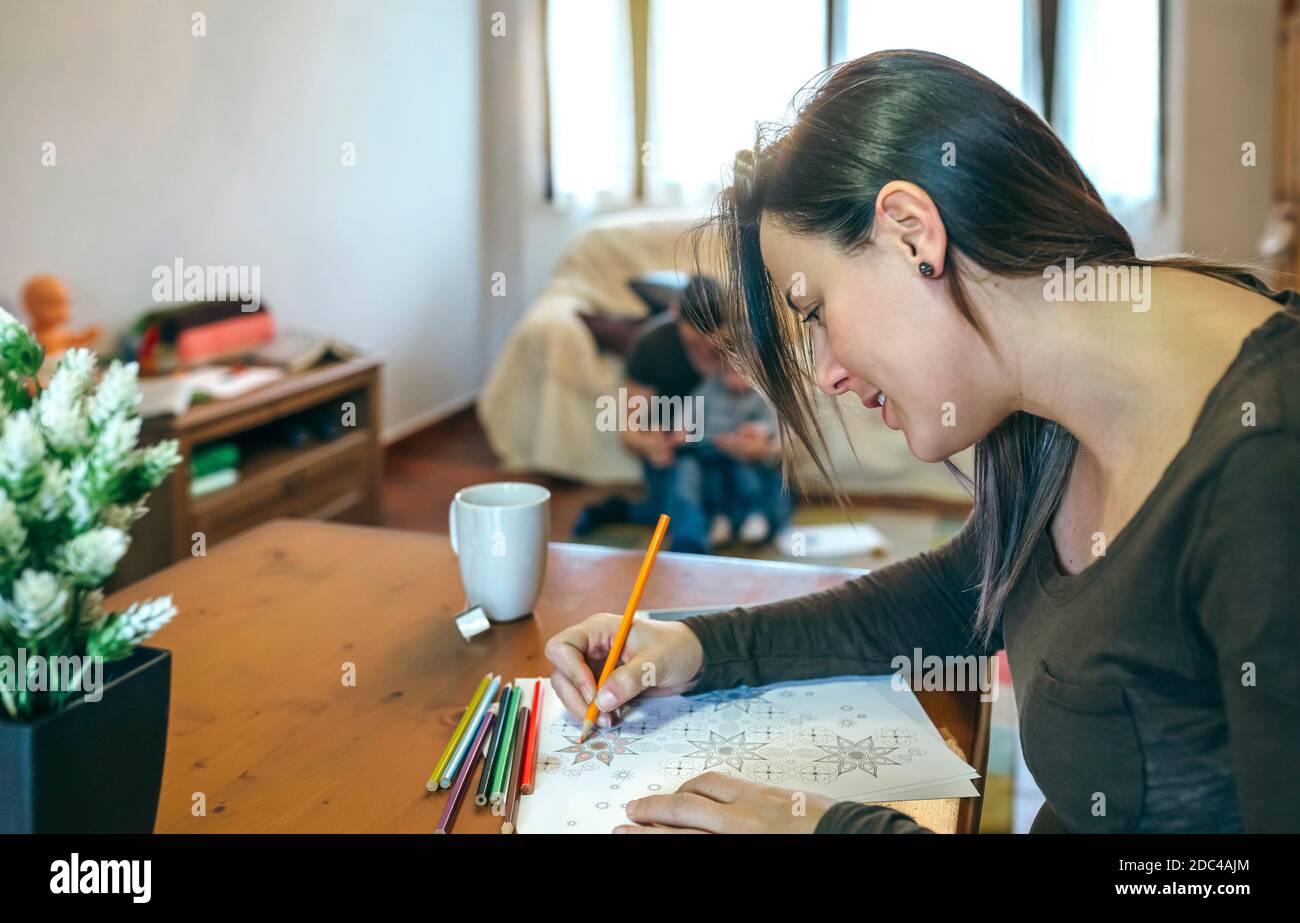 Young woman coloring mandalas Stock Photo