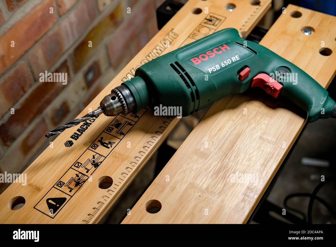 https://c8.alamy.com/comp/2DC4APA/norwich-norfolk-uk-november-17-2020-an-illustrative-photo-of-a-bosch-power-drill-on-a-black-decker-workmate-bench-2DC4APA.jpg