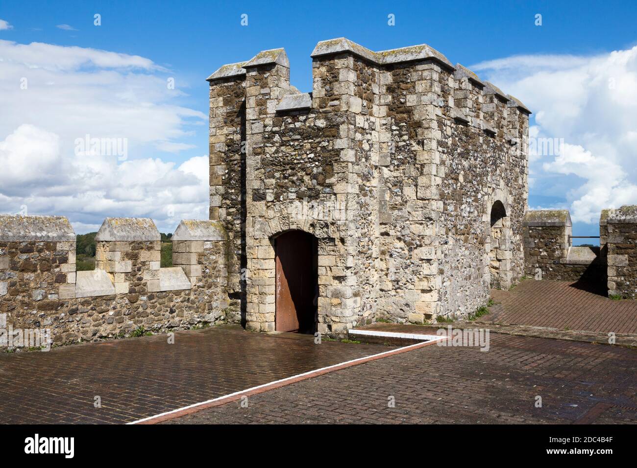 The roof and corner tower with castellated walls at the top of the