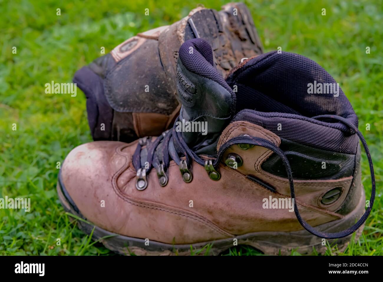 Norwich, Norfolk, UK – November 17 2020. An illustrative photo of a pair of well-worn and muddy Hi-Tec walking boots Stock Photo