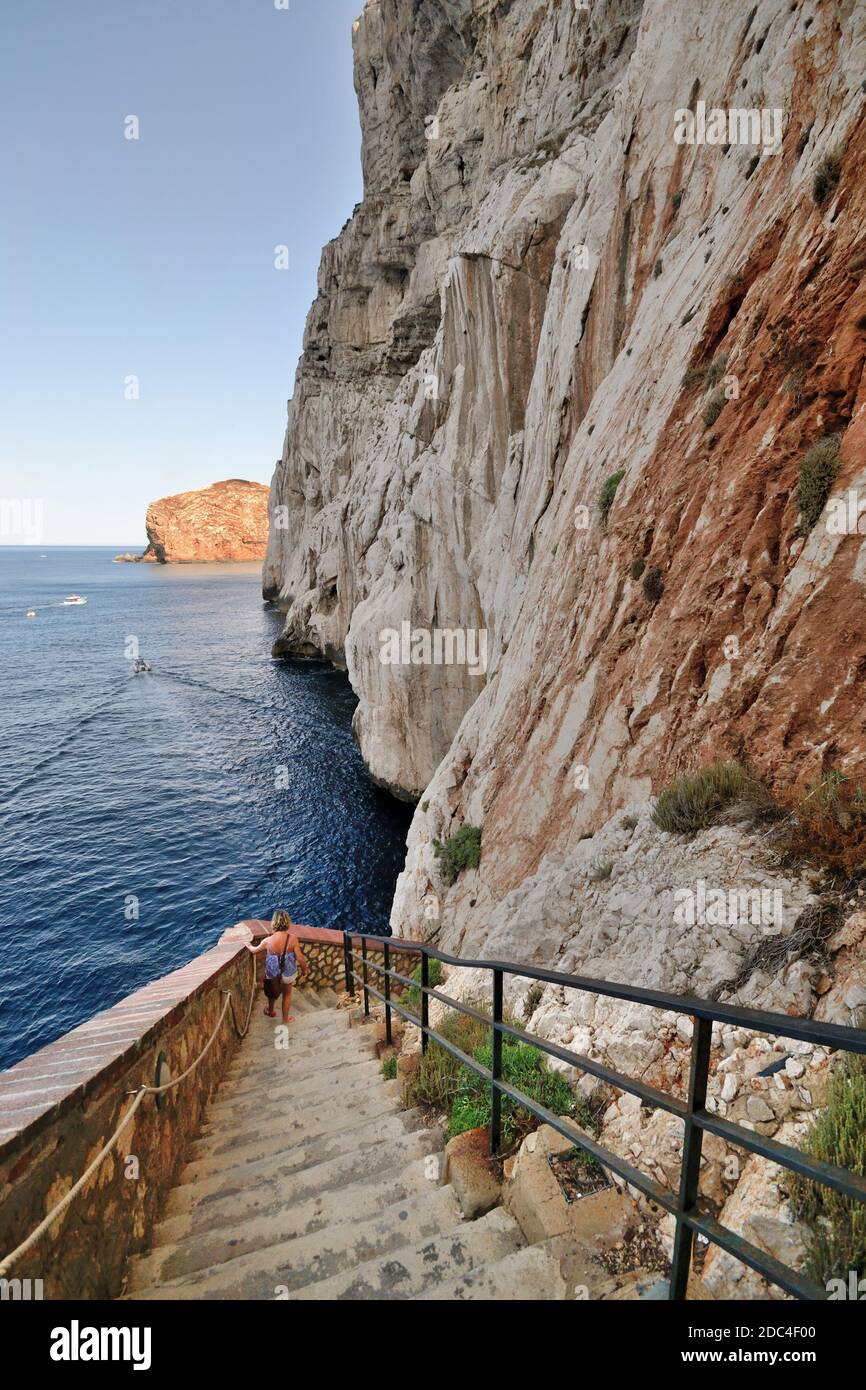 The stairway leading to the Neptune's Grotto,near Alghero. Boat sailing to Grotte di Nettuno in Sardinia Stock Photo