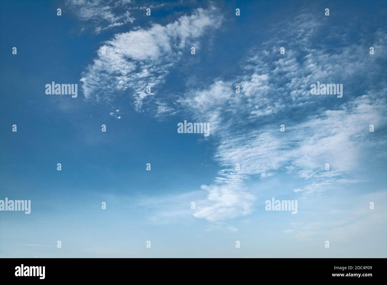 White fluffy clouds in the blue sky. Blue summer sky with white cumulus ...