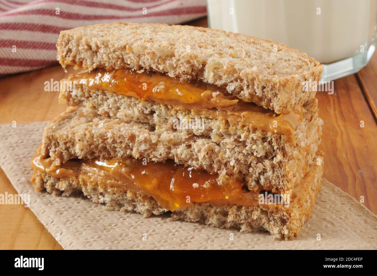 Peanut butter and jam sandwich on organic whole grain bread Stock Photo