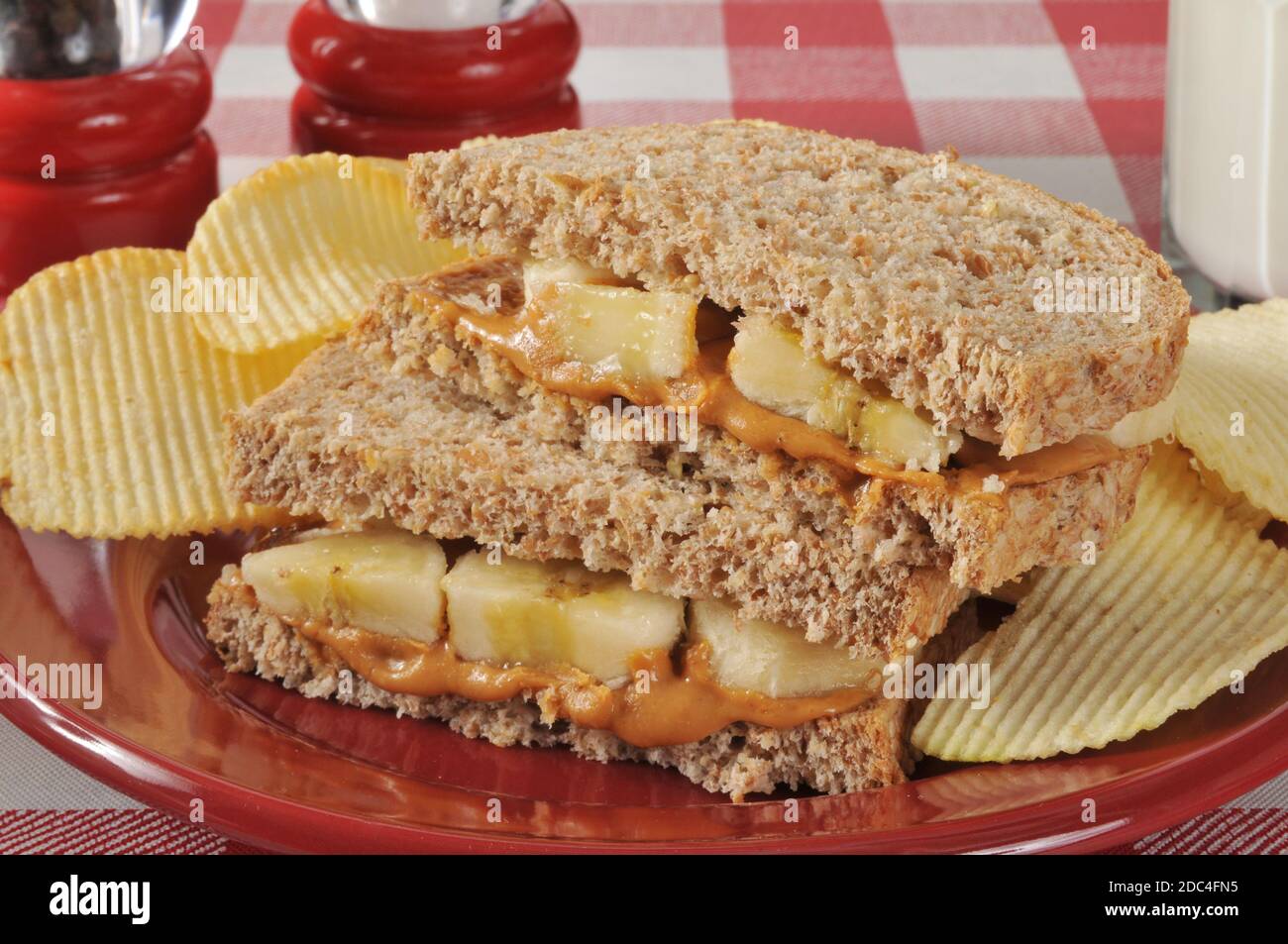 A Peanut Butter And Banana Sandwich On Whole Wheat Bread With Potato Chips Stock Photo Alamy A Peanut Butter And Banana Sandwich On Whole Wheat Bread With Potato Chips Stock Photo Alamy