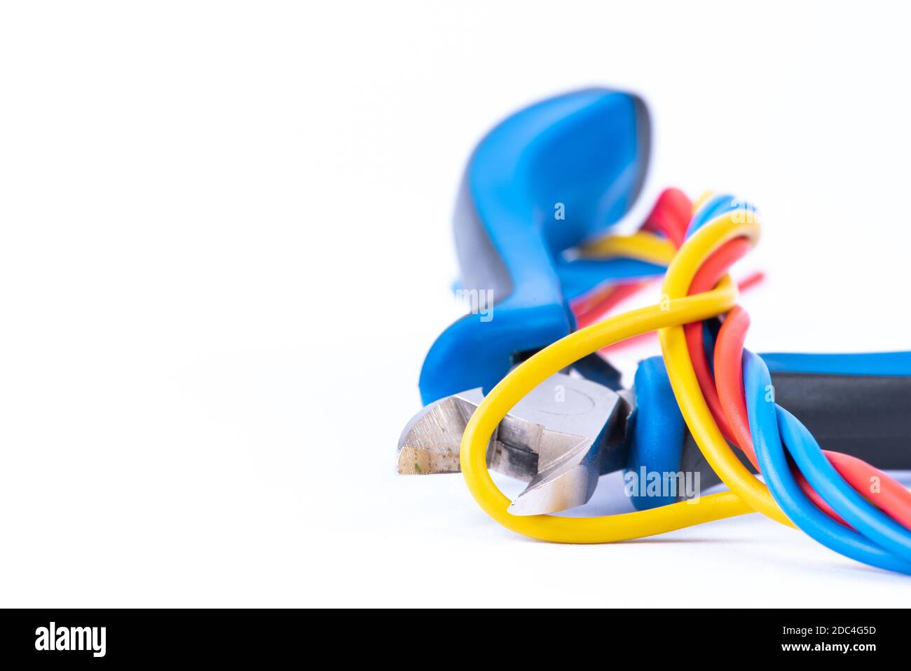 Electrical installation pliers and cabling closeup, isolated on white