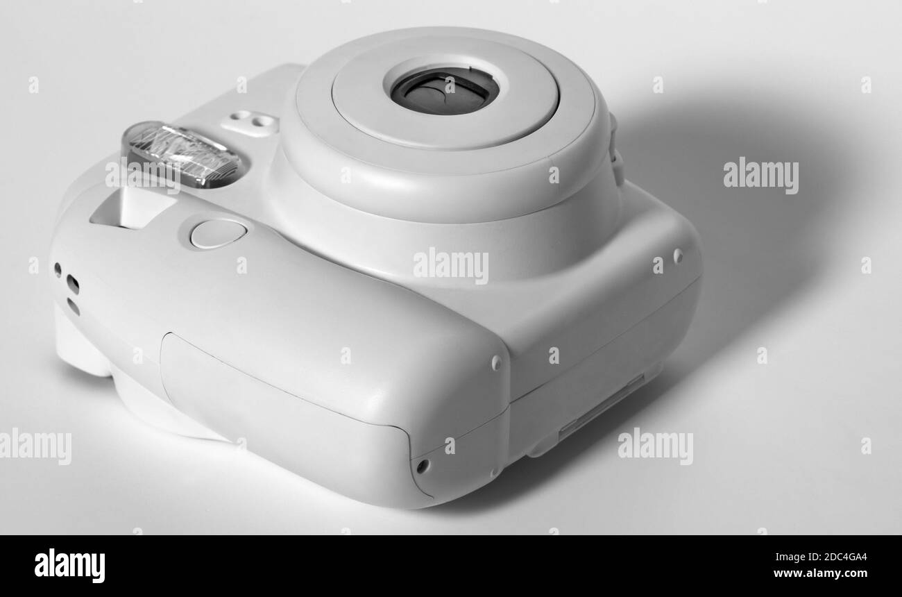 Old white plastic camera on a white background. Stock Photo