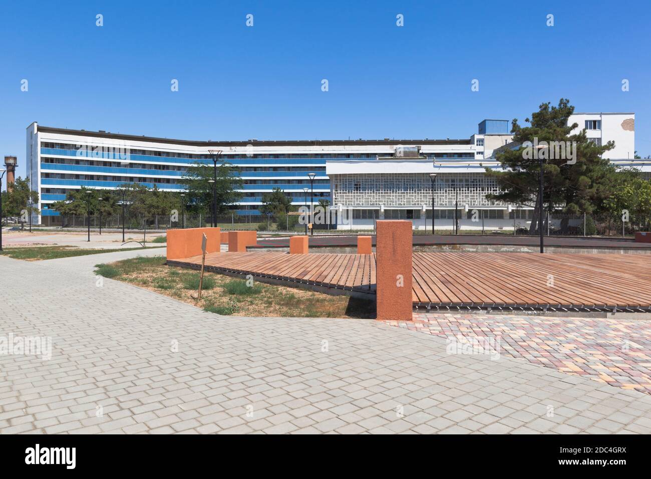 Saki, Crimea, Russia - July 23, 2020: Square in front of the building of the sanatorium named after academician Nikolai Nilovich Burdenko in the resor Stock Photo