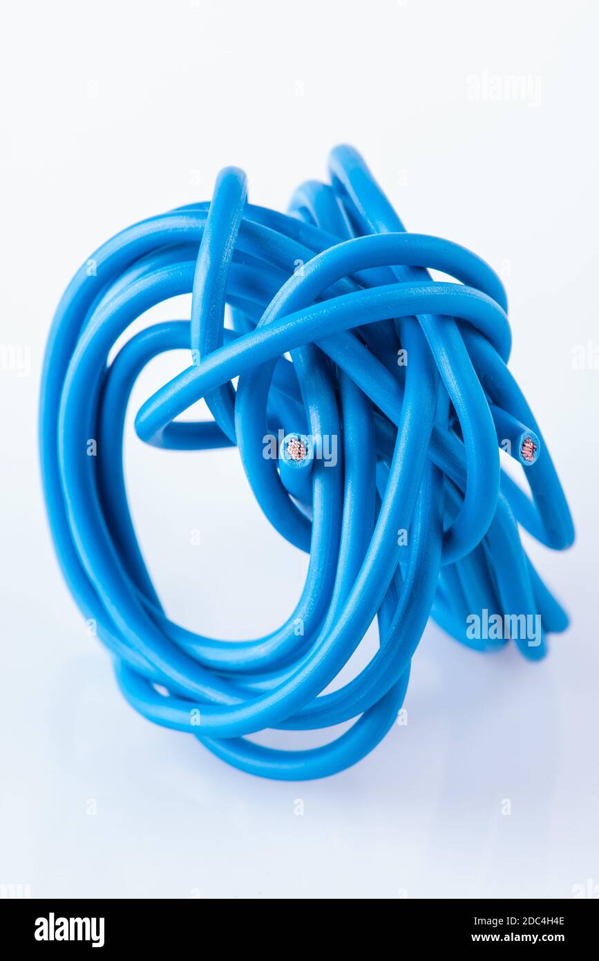 Scroll of scrap electric copper cable used in electrical installation, close-up Stock Photo