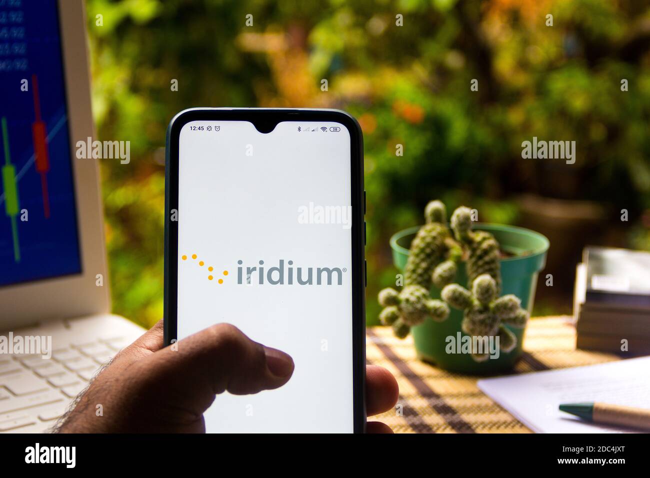 In this photo illustration the Iridium Satellite Communications logo seen displayed on a smartphone Stock Photo
