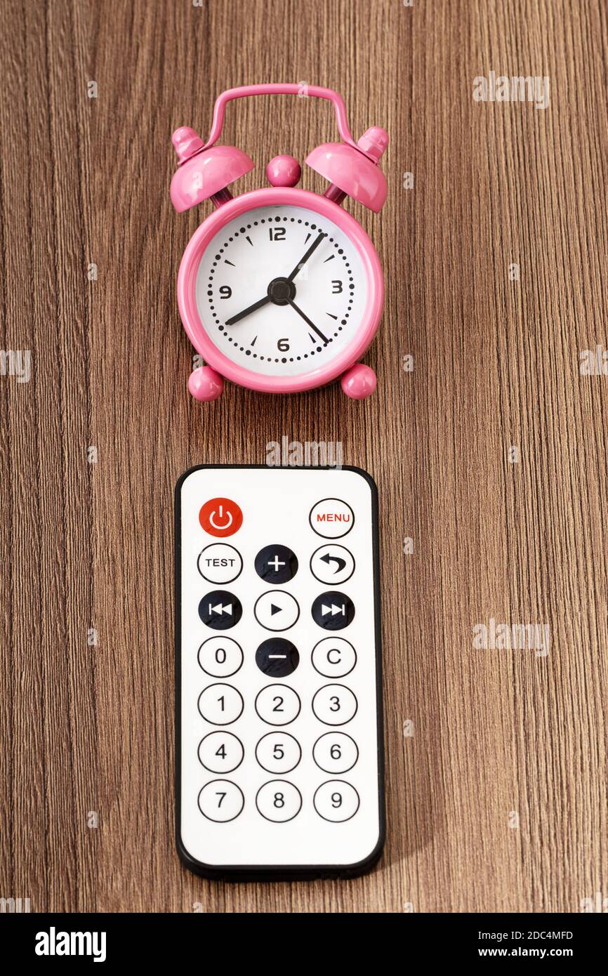 Remote control and alarm clock Stock Photo Alamy