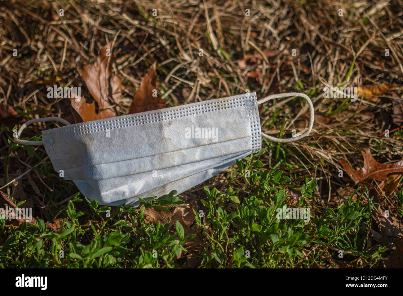 Discarded face masks in Mccarren Park, Brooklyn, New York during the COVID-19 pandemic in the Fall of 2020. Stock Photo