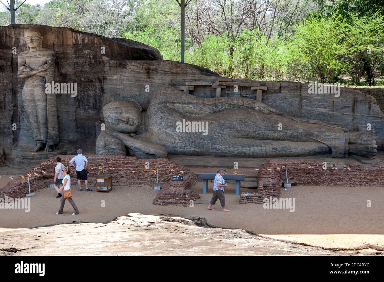 The Gal Vihara at Polonnaruwa in Sri Lanka which includes a standing and a reclining Buddha statue carved out of a single slab of granite rock. Stock Photo