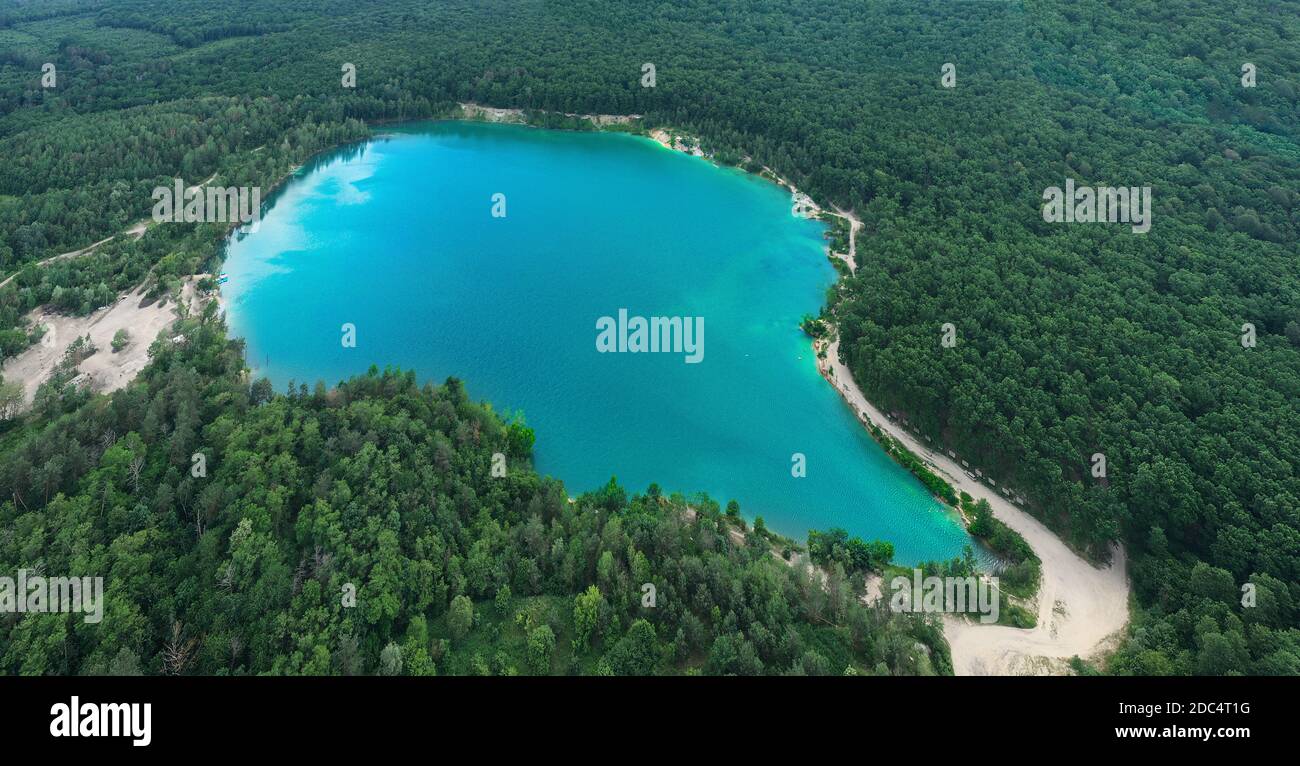Lake in the forest with blue water Stock Photo - Alamy