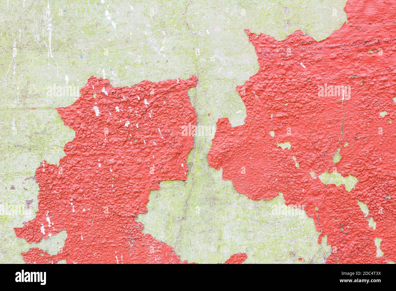 grunge wall with red cracked color caused by moisture and temperature Stock Photo