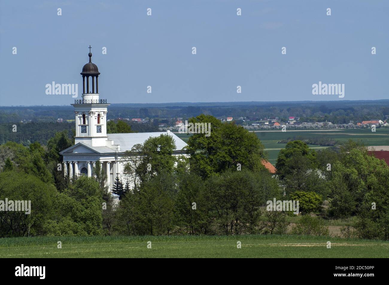 Polska, Poland, Polen, Europe, Greater Poland, Großpolen; Brzóstków - the church of St. John the Baptist against the blue sky. Stock Photo