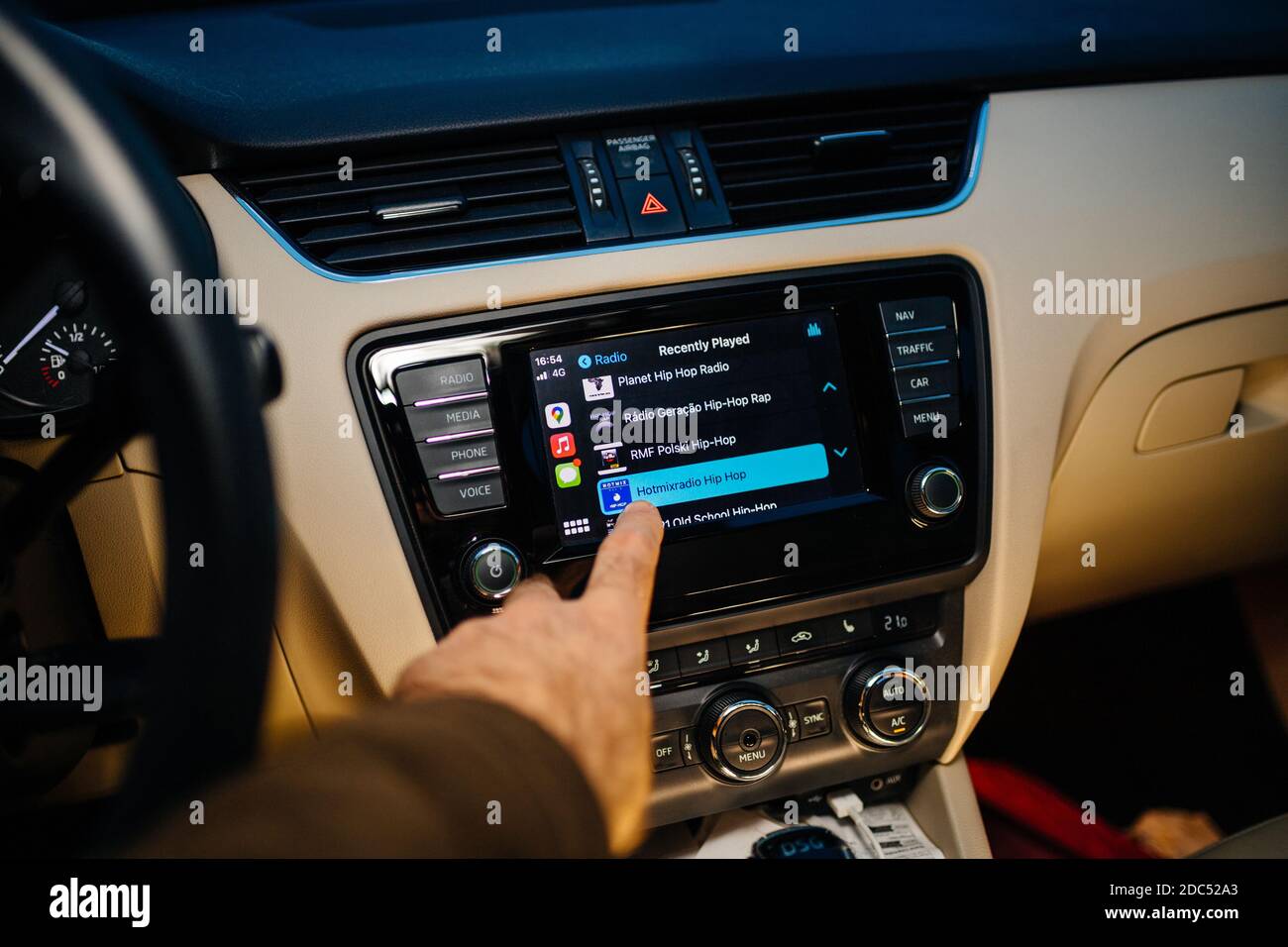 Paris, France - Nov 11, 2020: Personal perspective POV of male hand  touching the infotainment car computer system running Apple Computers  CarPlay playing Hot Mix Radio Hip-Hop on Apple Music Stock Photo - Alamy