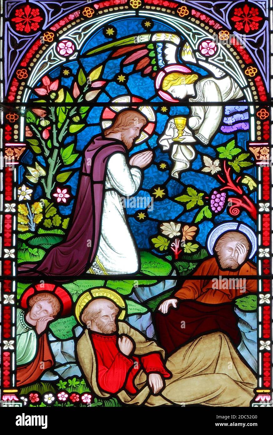 Jesus prays in Garden of Gethsamane, Disciples sleep, Old Hunstanton stained glass window,detail of life of Jesus, by Frederick Preedy, 1867 Stock Photo