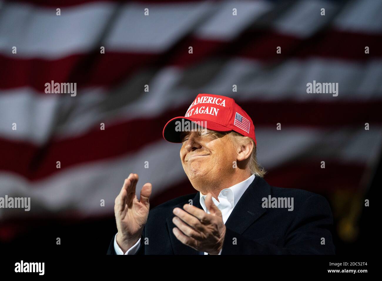 US President Donald Trump smiles during a Make America Great Again campaign event at Des Moines International Airport on October 14, 2020 in Des Moines, Iowa. Trump campaigns a week after recovering from COVID-19. Credit: Alex Edelman/The Photo Access Stock Photo