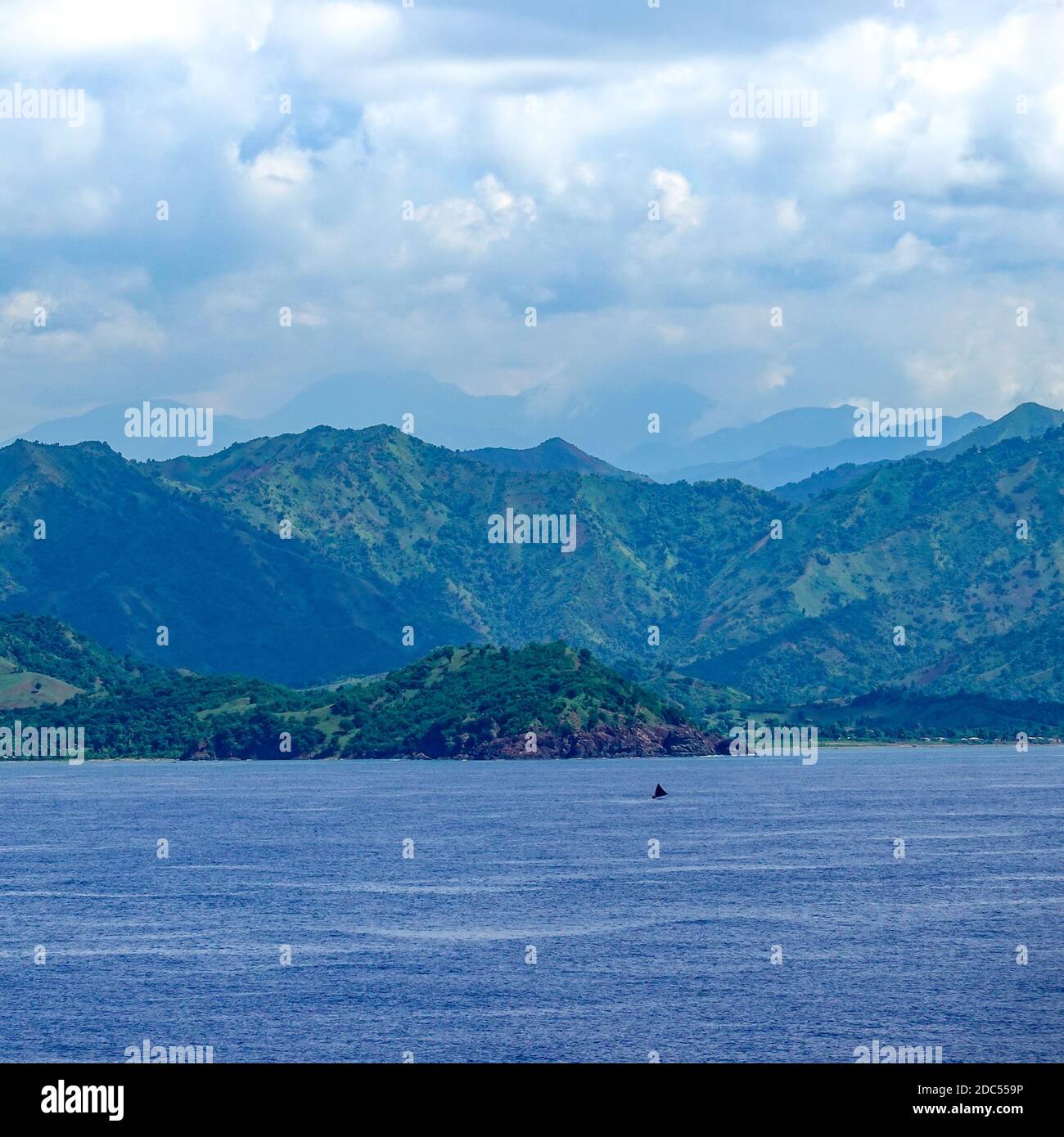 Haiti-11/1/19: The hazy and mountainous coastline of the Caribbean Island of Haiti as a cruise ship sails by. Stock Photo