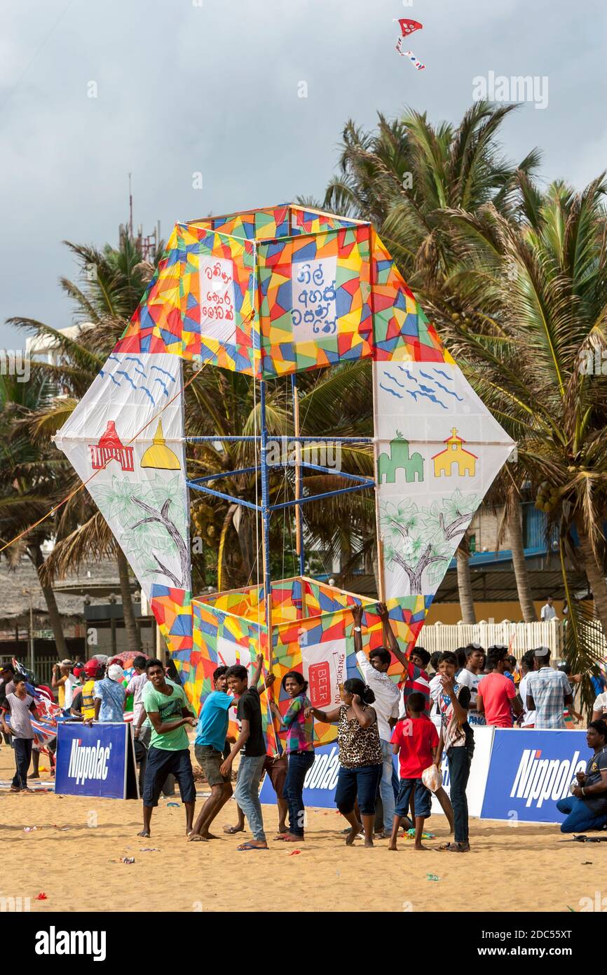 An enormous kite is prepared for takeoff above Negombo beach on the