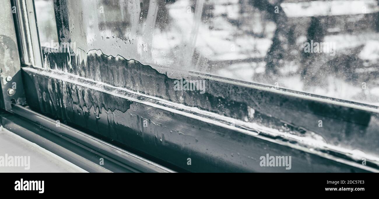 Window humidity condensation in home interior during cold winter weather panoramic background