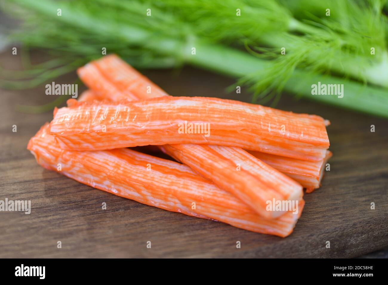 Crab sticks on wooden cutting board and vegetable , Fresh crab sticks