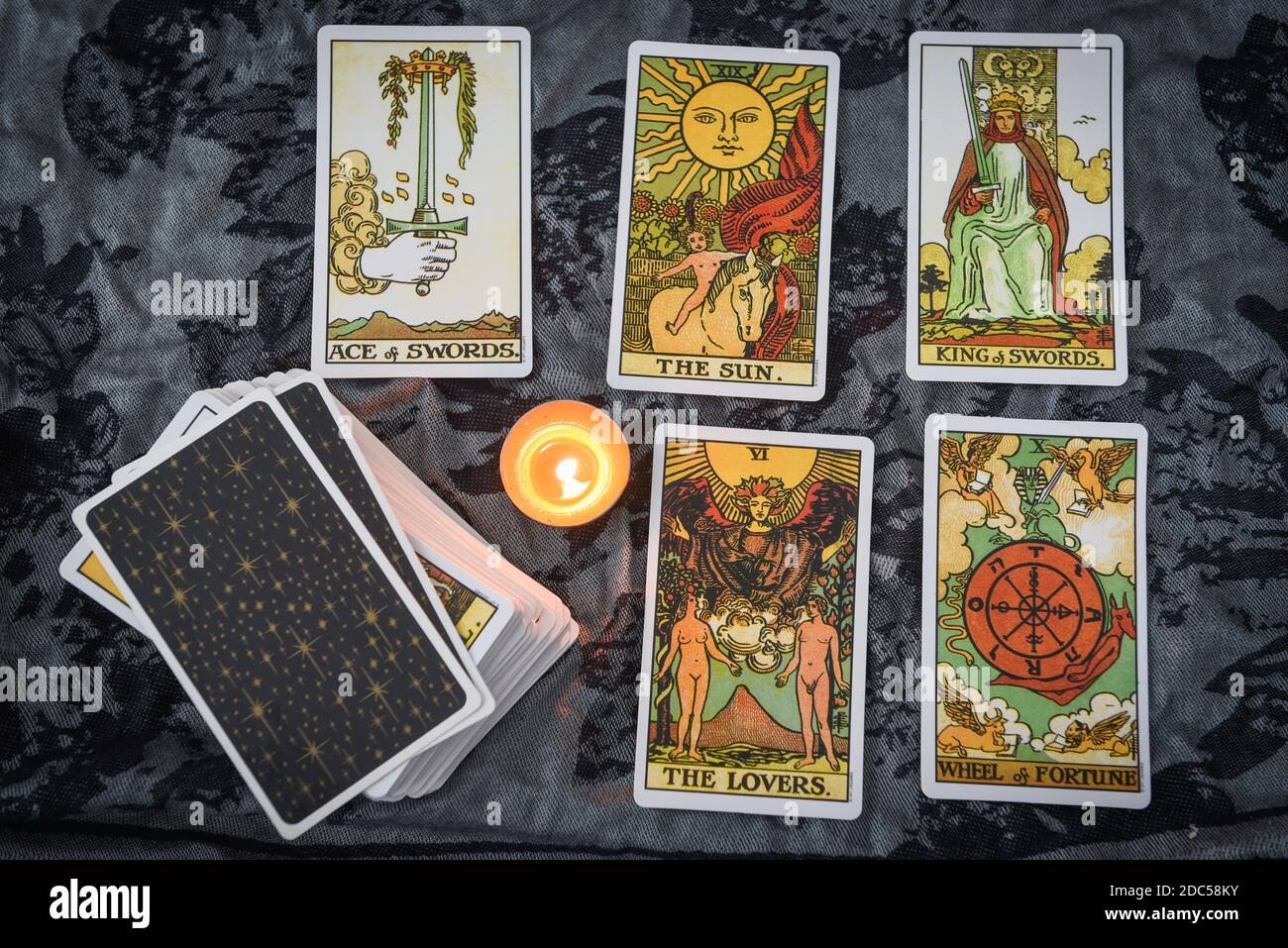 Tarot cards by candlelight on dark fortune card prophecy, gypsy card fortune teller reading future : Bangkok Thailand October 30 , 2020 Stock Photo - Alamy