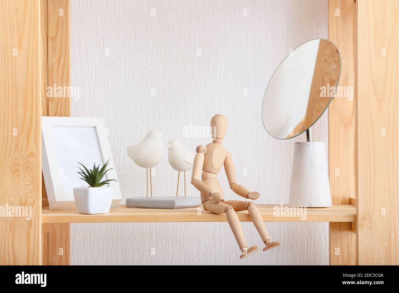 Still life. Wooden drawing mannequin dummy to learn how to draw human body  in position of movement, displayed on shelf in creative department of schoo  Stock Photo - Alamy