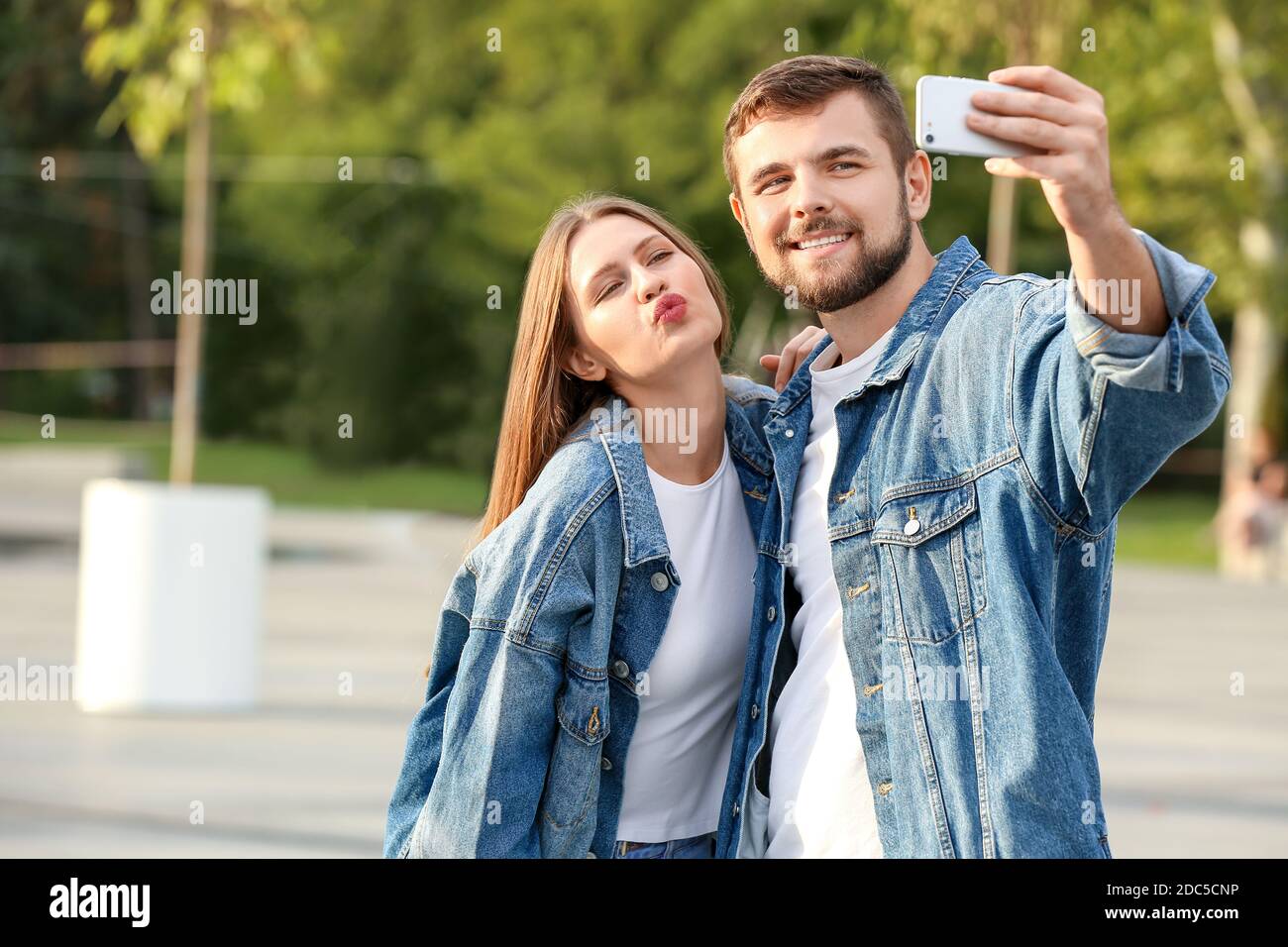 Young couple taking selfie outdoors Stock Photo - Alamy