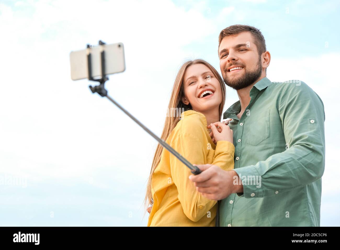Young couple taking selfie outdoors Stock Photo - Alamy