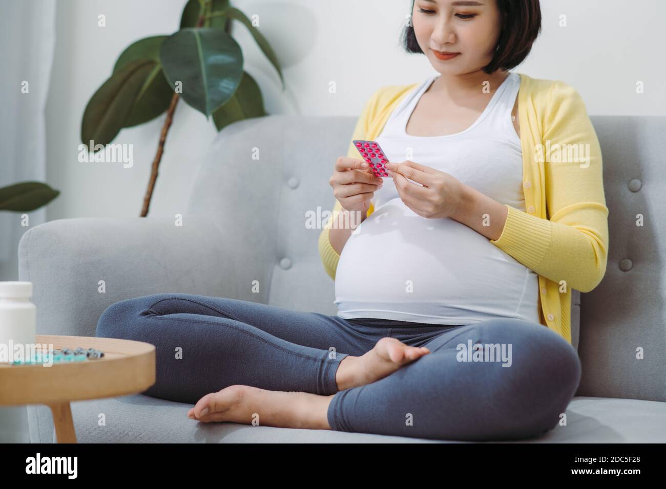 Woman hands read how to use birth control pills in hand Stock Photo