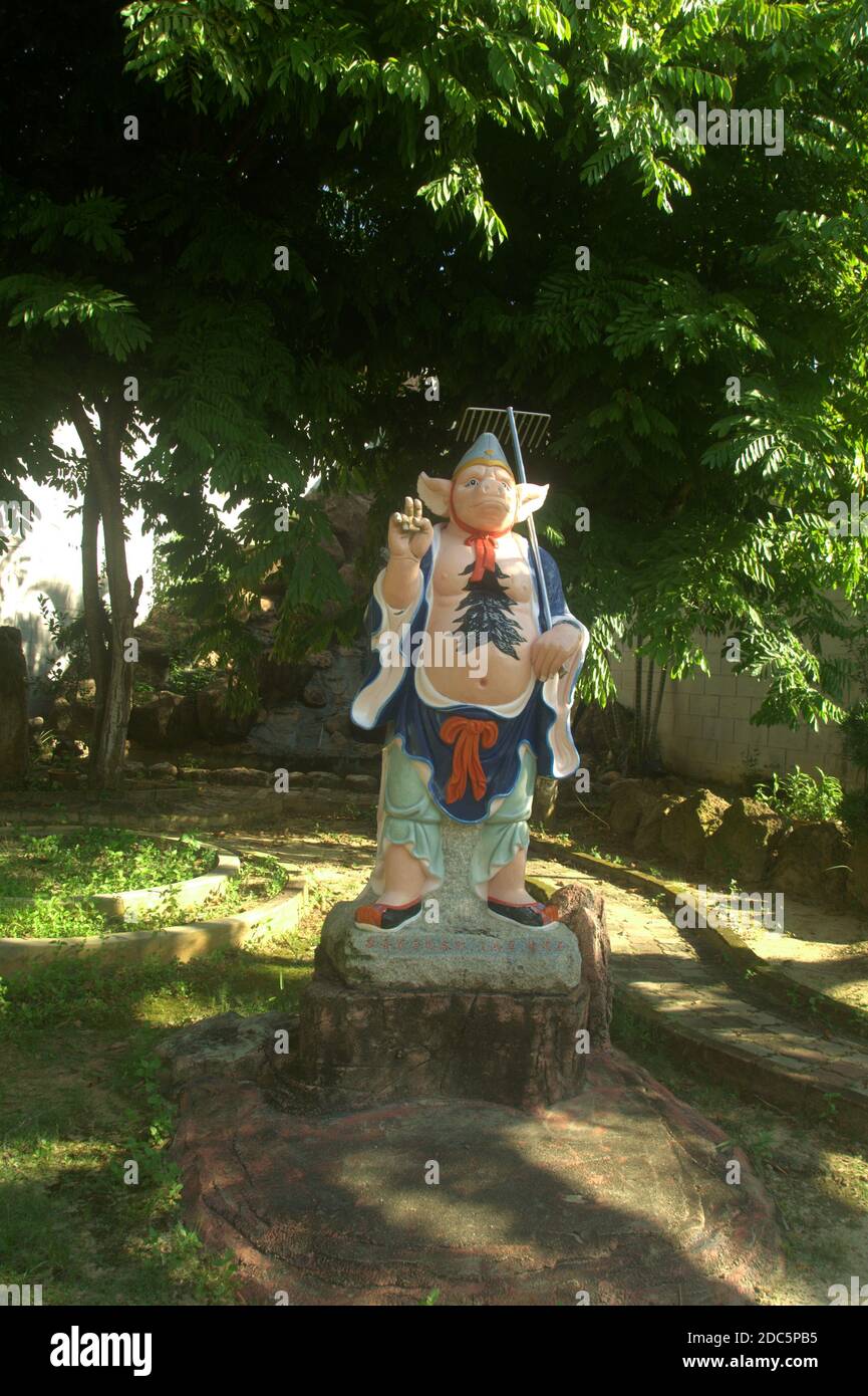 a legend pig king statue inside the temple yard in Port Dickson Malaysia Stock Photo