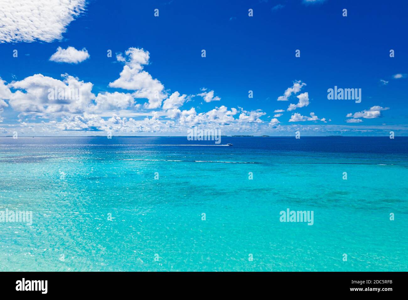 Amazing seascape, beautiful turquoise tropical ocean water with boat on it top view aerial photo. Maldives Indian ocean, aerial seascape, landscape Stock Photo