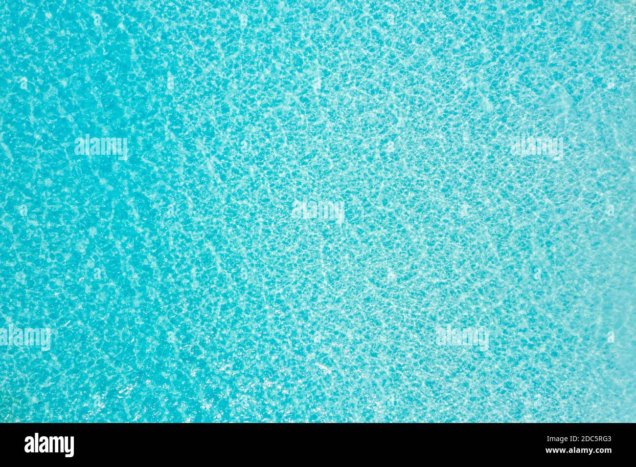 Sea from above drone view. Blue sea surface, top view. Amazing nature ocean pattern, shallow lagoon, tropical water. Relaxing natural environment Stock Photo