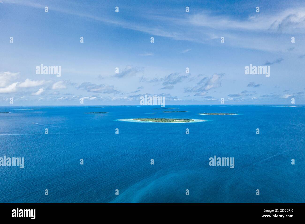 Amazing seascape, beautiful turquoise tropical ocean water with boat on it top view aerial photo. Maldives Indian ocean, aerial seascape, landscape Stock Photo