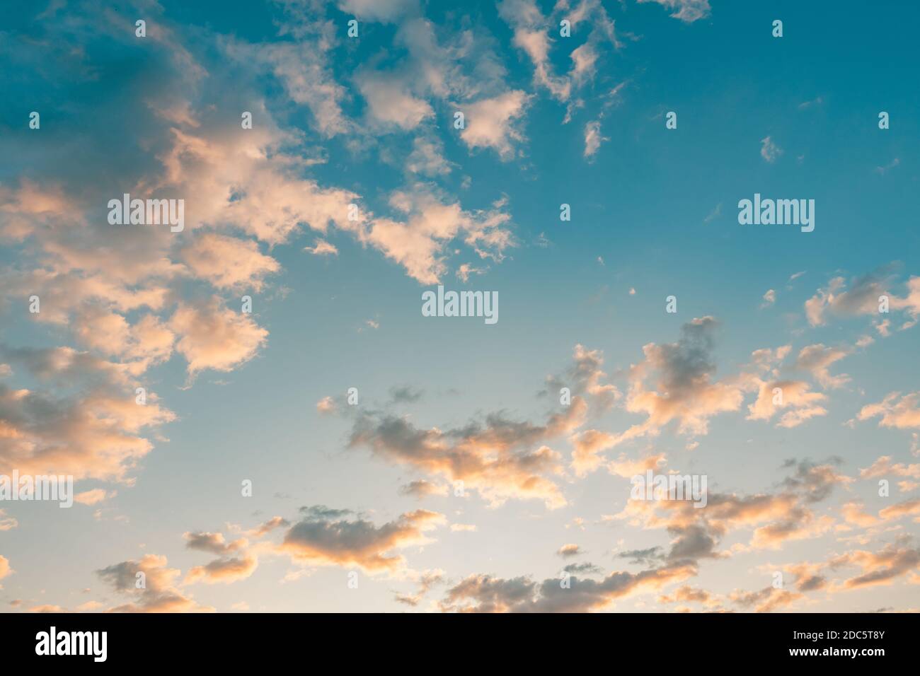 Sky with clouds and sun. Romantic skyscape, summer sky clouds, sunset colors. Dream weather, positive vibes, meditation Stock Photo