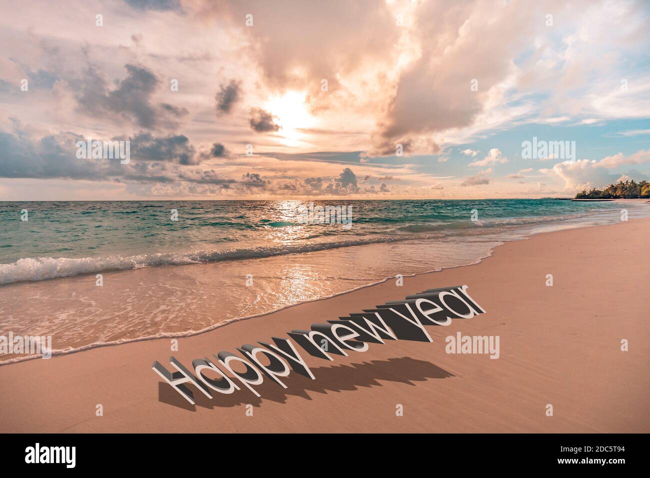 Happy new year written in the sky. Artistic summer beach holiday with new years eve concept Stock Photo